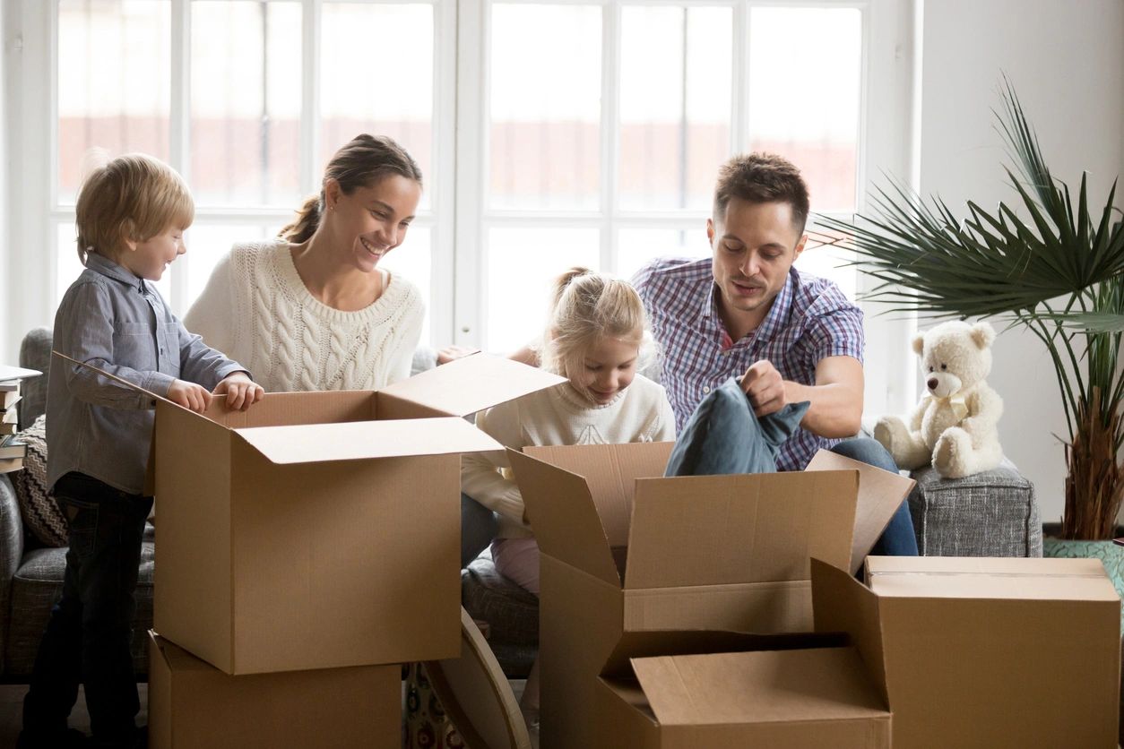 family unboxing their belongings